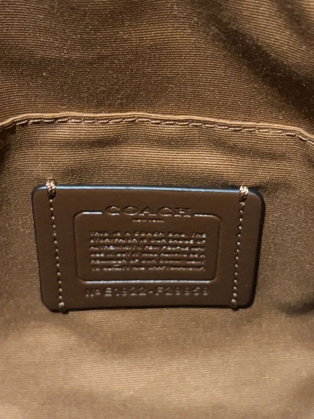 Coach Signature Pebbled Hobo Bag in Beige and White